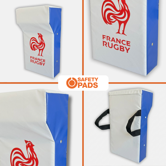 Four views of a France Rugby safety pad on a white background, showing the white and blue padded corner with a red rooster logo and 'FRANCE RUGBY' text, plus black carrying handles. A central 'SAFETY PADS' logo appears over the collage.