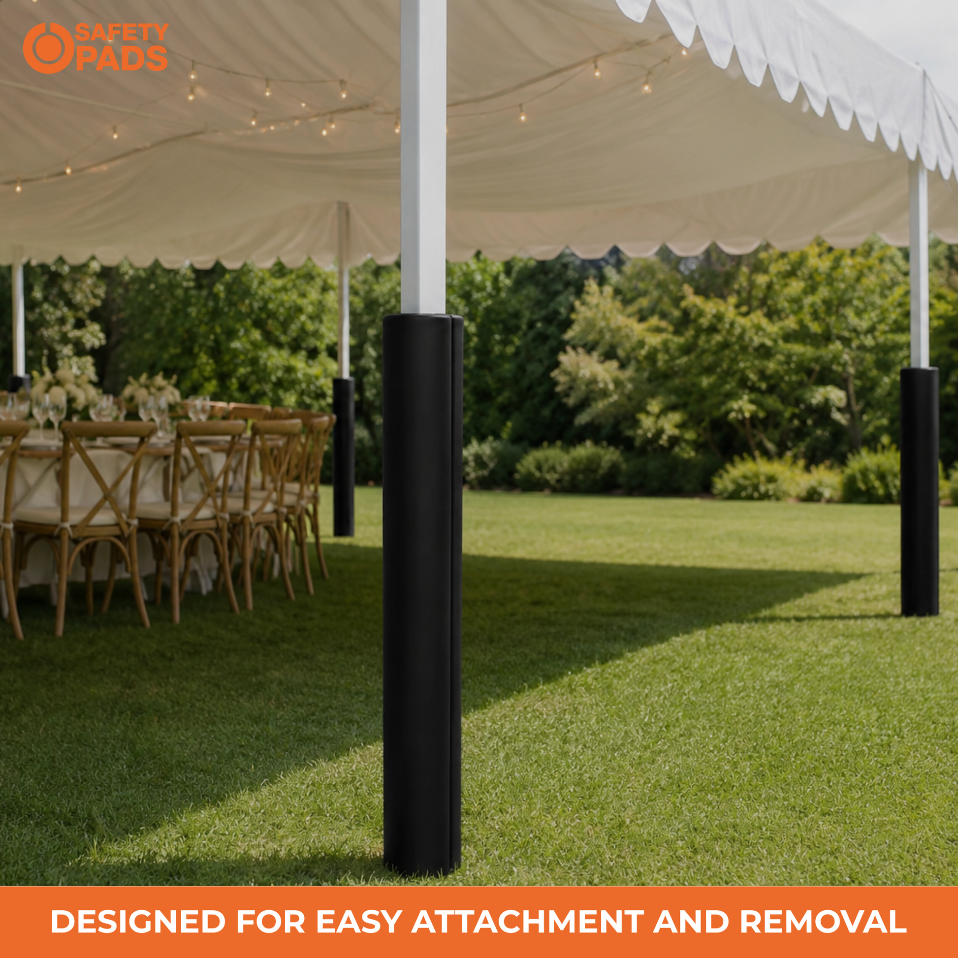 Black protective tent pole pads installed on white tent support poles in an outdoor grassy event space with tables and chairs under a white marquee canopy. An orange 'SAFETY PADS' logo appears in the top-left corner, and an orange banner at the bottom reads 'DESIGNED FOR EASY ATTACHMENT AND REMOVAL'.