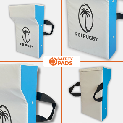 Four views of a rectangular safety pad with a white front, blue side panels, black carrying straps, and a black Fiji Rugby logo. A central logo reads Safety Pads.
