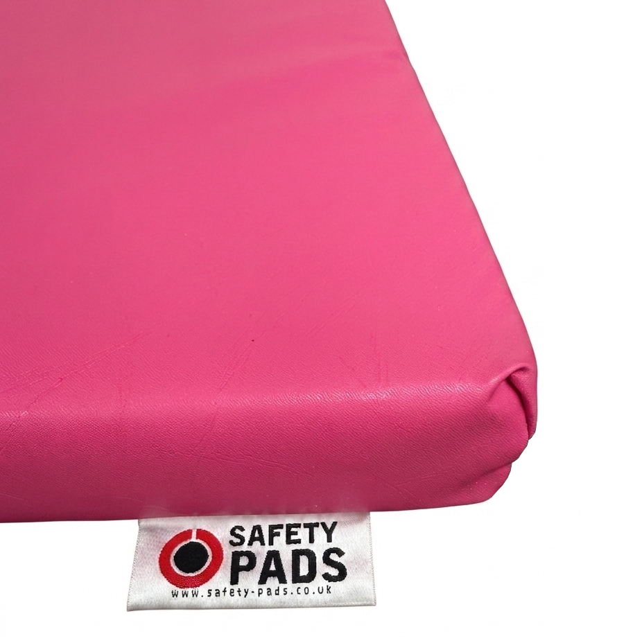 Pink Wall Pad with Tag on Corner